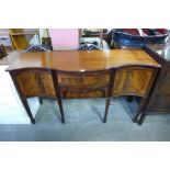 An inlaid mahogany serpentine sideboard