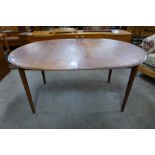 A teak extending dining table