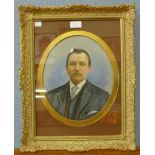 A half portrait of a gentleman, over painted photograph, 29cms x 24cms, framed