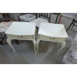 A pair of cream and parcel gilt bedside tables