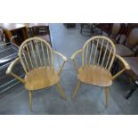 A pair of Ercol Blonde armchairs