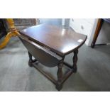 An oak drop-leaf occasional table