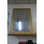 A gilt framed rectangular mirror
