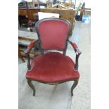 A French mahogany and upholstered open armchair