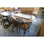 An Old Charm oak extending dining table and four chairs