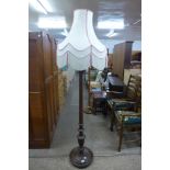 A mahogany standard lamp