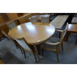 A G-Plan teak extending dining table and six chairs