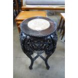 A Chinese Padouk marble topped jardiniere stand