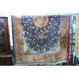 A hand knotted blue ground rug, 235cms x 144cms.