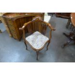 An Edward VII inlaid mahogany elbow chair