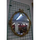 A gilt framed mirror