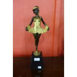 A bronze figure of a ballerina on marble plinth