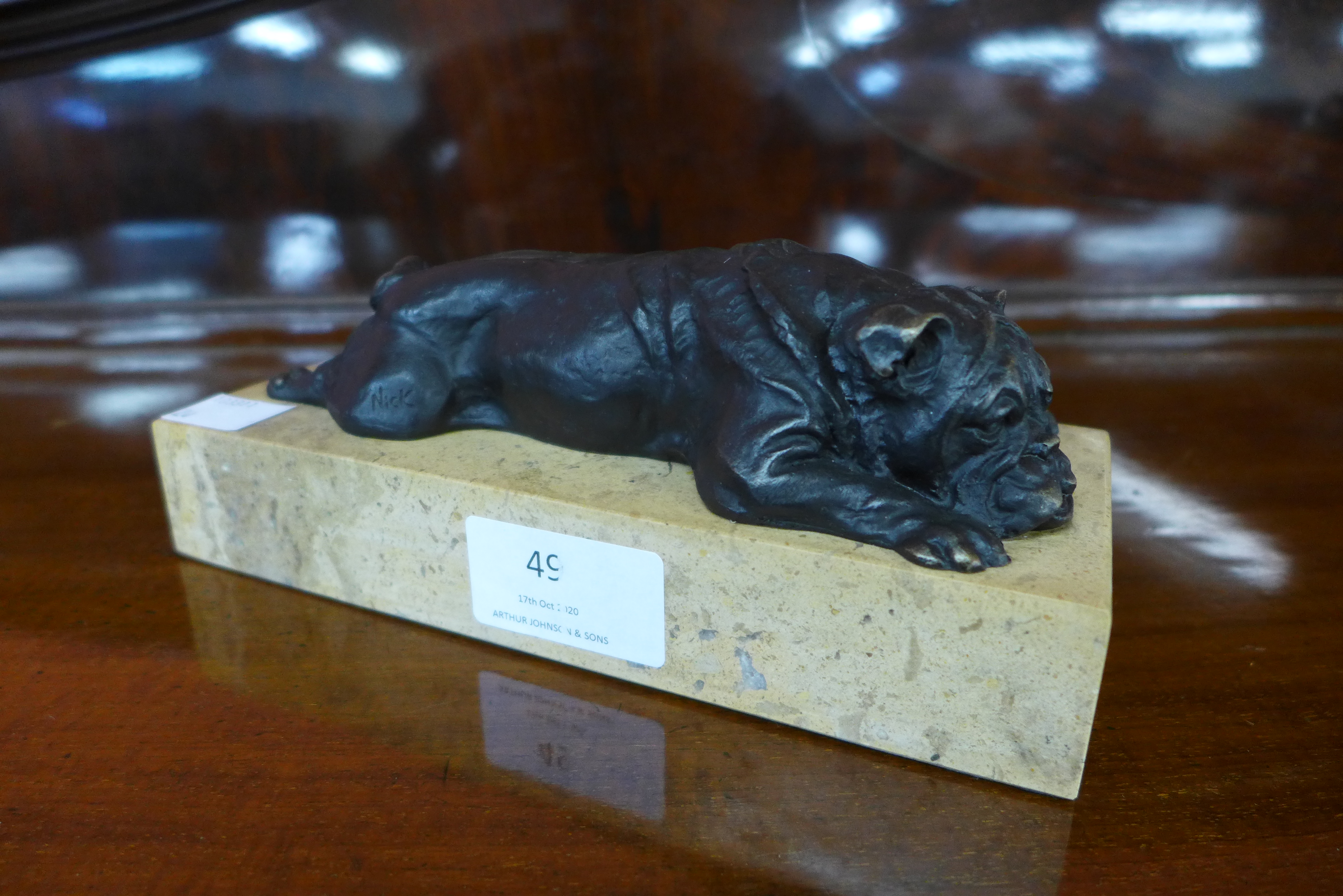 A bronze bulldog on marble plinth