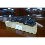 A bronze bulldog on marble plinth