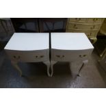 A pair of painted bedside tables