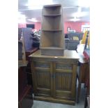 An Old Charm oak TV cabinet and a corner bookcase