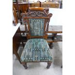 An Edward VII carved walnut and upholstered dining chair