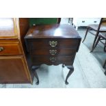 A small mahogany drop-leaf chest of drawers