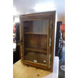 A small pine hanging display cabinet