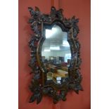A carved oak framed mirror