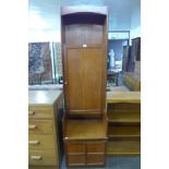 A teak hall cupboard