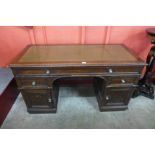 A Victorian oak pedestal desk