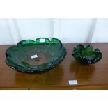 A heavy green glass bowl and matching ashtray