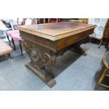 A Victorian carved oak two drawer table