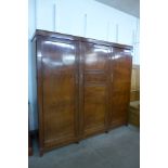 An early 20th Century mahogany three door Compactum wardrobe