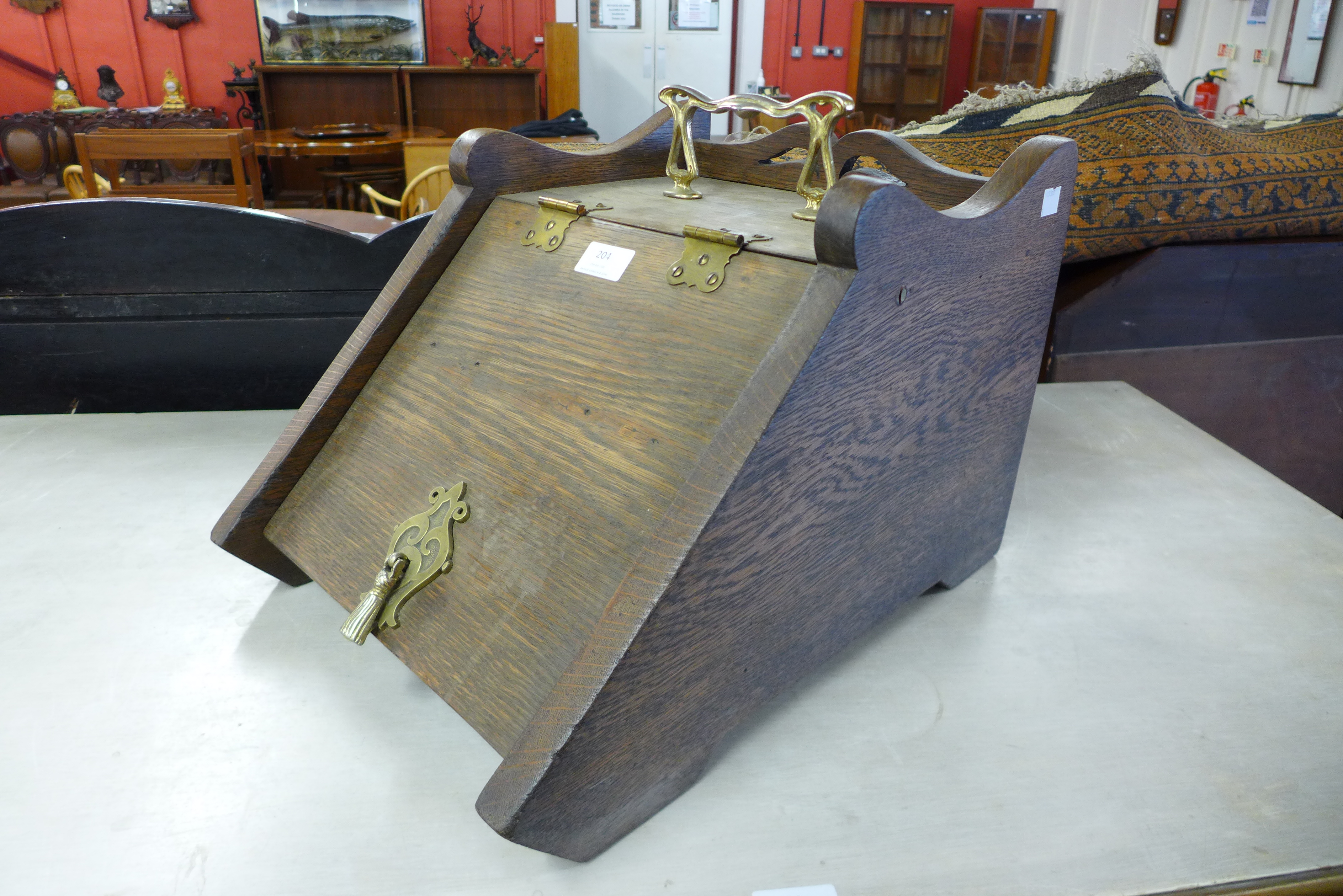 An Edward VII oak and brass mounted coal scuttle