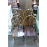 A set of four beech wheelback chairs