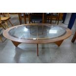 A G-Plan Astro teak and glass topped oval coffee table