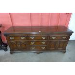 A George III style oak and mahogany crossbanded dresser, 88cms h, 200cms w, 55cms d