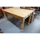 A pine two drawer kitchen table