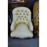 A Victorian mahogany and upholstered armchair