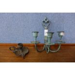 A bronze candlestick and one other