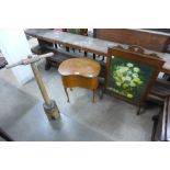 A 19th Century beech butter churn, walnut sewing table and an oak fire screen