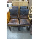 A set of four oak and leather chairs