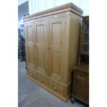 A pine three door wardrobe