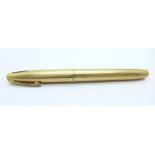 A gold plated Sheaffer pen with 14k gold nib