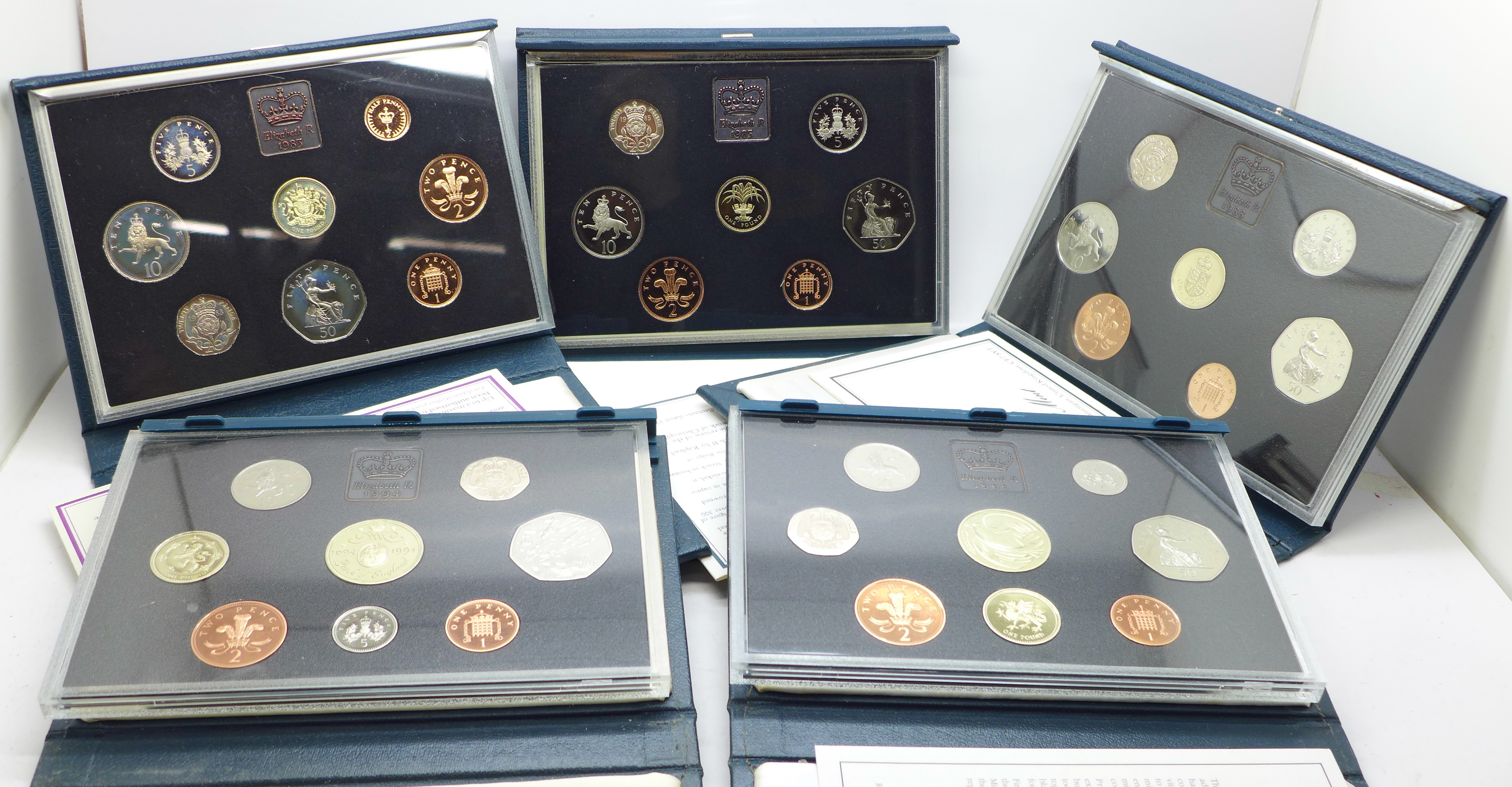 Five Royal Mint proof coin sets