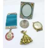 A silver medal and assorted items