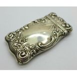 A sterling silver embossed vesta case