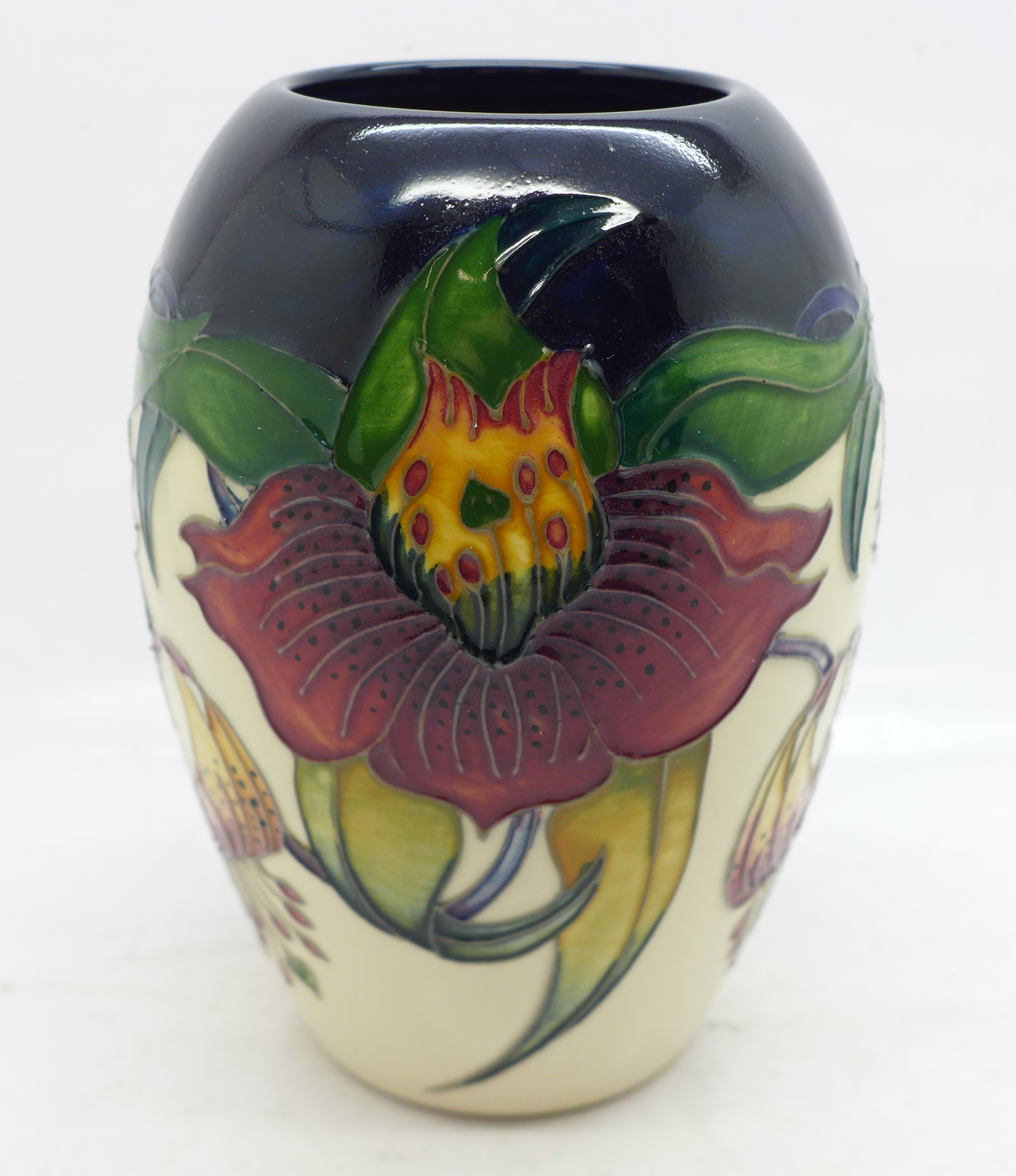 A Moorcroft vase, Anna Lily pattern, shape no. 102/5, by designer Nicola Slaney, 13cm