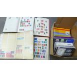 Stamps; a box of stamp albums, covers, presentation packs, year books, etc.