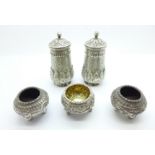 An Eastern cruet set, tests as silver, 222g