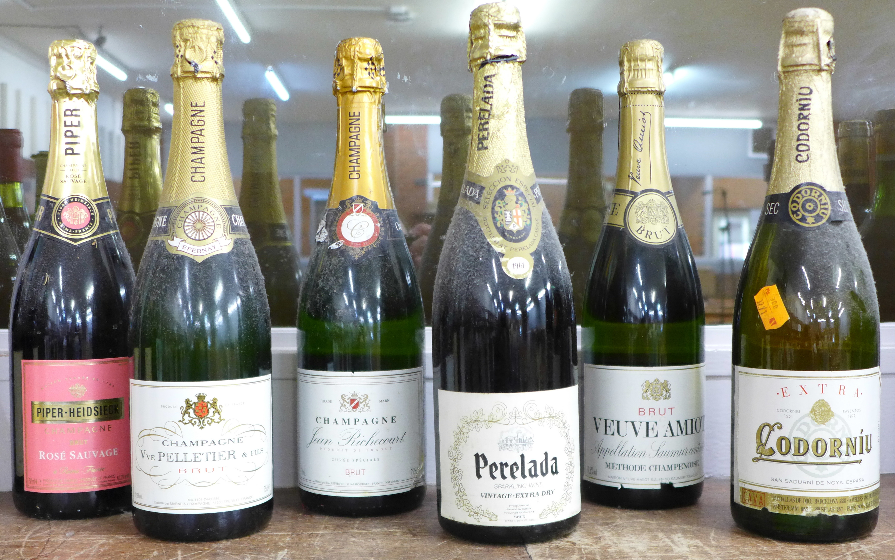 A bottle of Piper Heidsieck champagne and Jean Richcourt champagne and four bottles of Brut