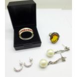 A silver ring with citrine coloured stone, one other ring and two pairs of earrings