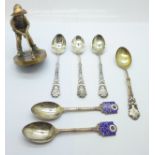 Six silver golfing spoons, 99g, and a golf mascot/trophy top