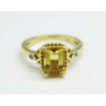 A 9ct gold and citrine ring with diamond shoulders, 2.9g, M